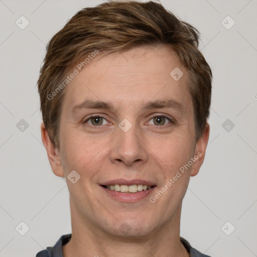 Joyful white adult male with short  brown hair and grey eyes