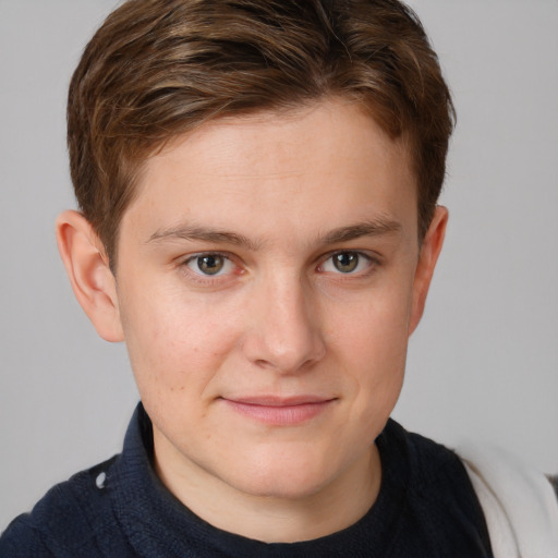 Joyful white young-adult male with short  brown hair and blue eyes