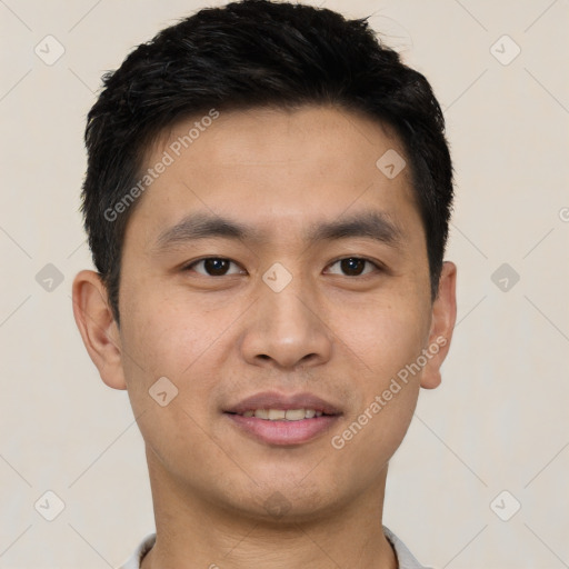 Joyful asian young-adult male with short  black hair and brown eyes