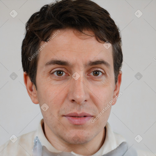 Joyful white adult male with short  brown hair and brown eyes