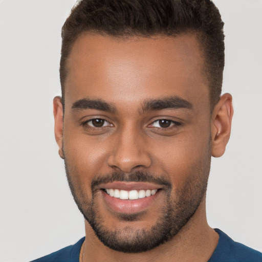 Joyful white young-adult male with short  brown hair and brown eyes