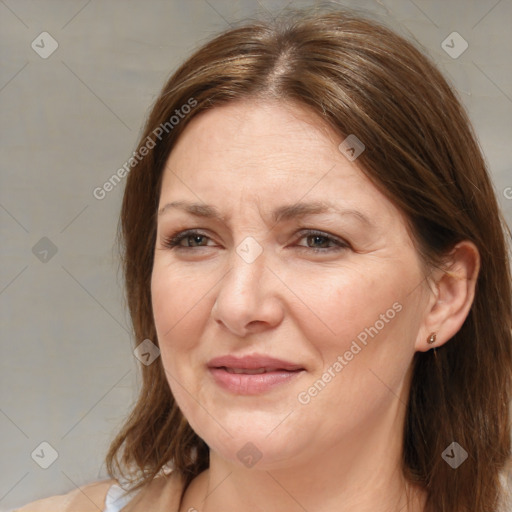 Joyful white adult female with medium  brown hair and brown eyes