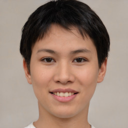 Joyful asian young-adult female with short  brown hair and brown eyes