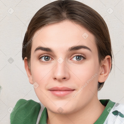 Joyful white young-adult female with medium  brown hair and green eyes