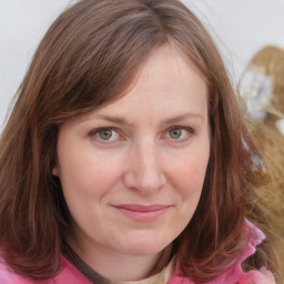 Joyful white young-adult female with medium  brown hair and blue eyes