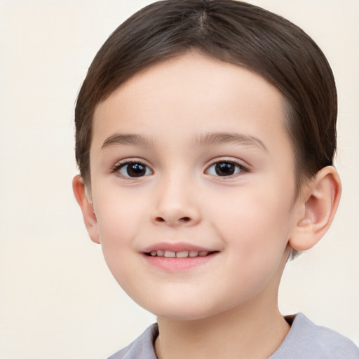 Joyful white child female with short  brown hair and brown eyes