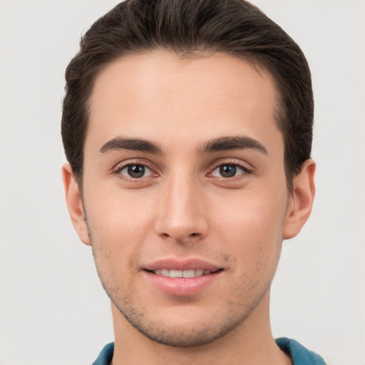 Joyful white young-adult male with short  brown hair and brown eyes