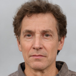 Joyful white middle-aged male with short  brown hair and brown eyes