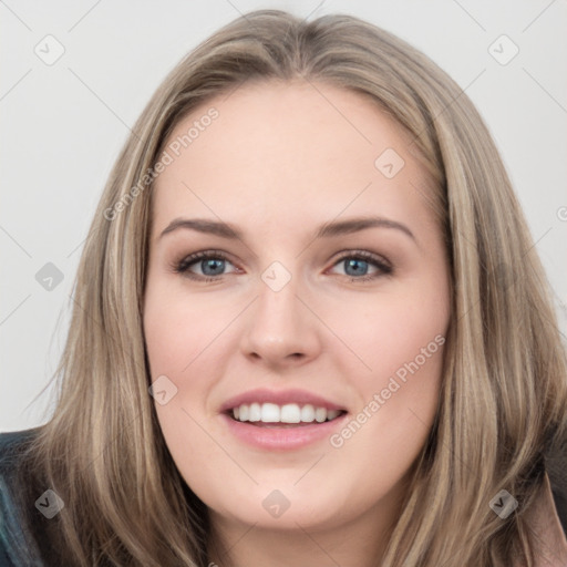 Joyful white young-adult female with long  brown hair and grey eyes