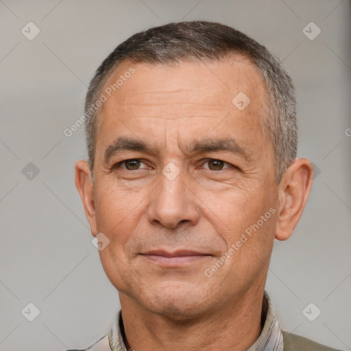 Joyful white middle-aged male with short  brown hair and brown eyes