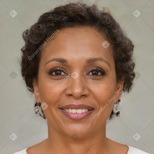 Joyful black adult female with short  brown hair and brown eyes