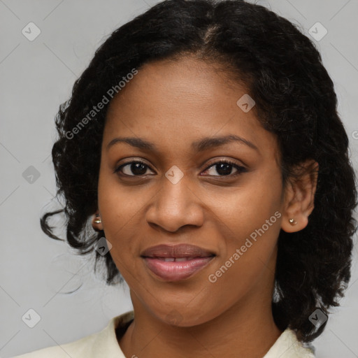 Joyful black young-adult female with medium  brown hair and brown eyes