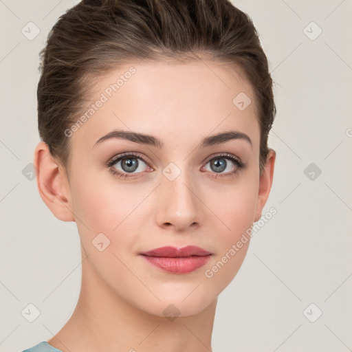 Joyful white young-adult female with short  brown hair and grey eyes