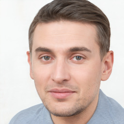 Joyful white young-adult male with short  brown hair and brown eyes