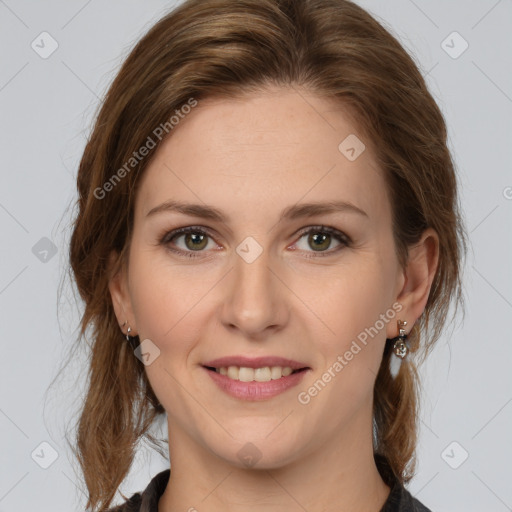 Joyful white young-adult female with medium  brown hair and green eyes