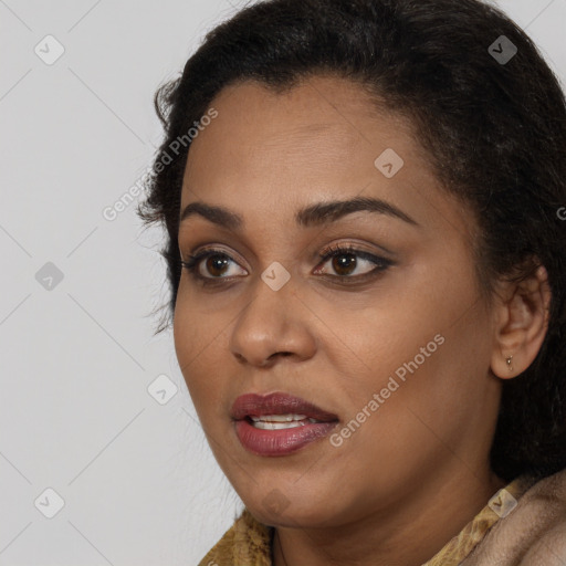 Joyful black young-adult female with medium  brown hair and brown eyes