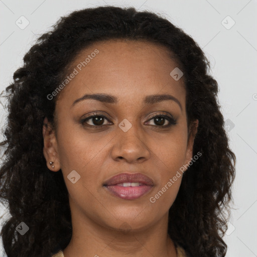 Joyful black young-adult female with long  brown hair and brown eyes