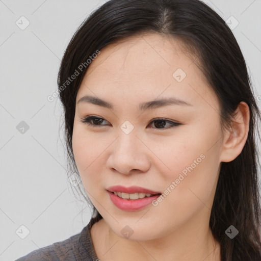 Joyful asian young-adult female with long  brown hair and brown eyes