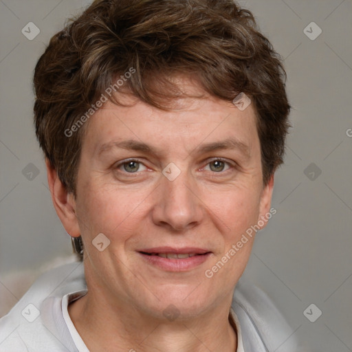 Joyful white adult female with short  brown hair and grey eyes