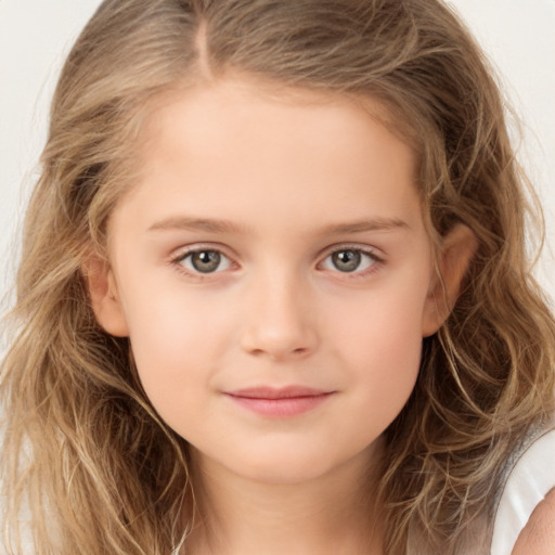 Joyful white child female with long  brown hair and brown eyes