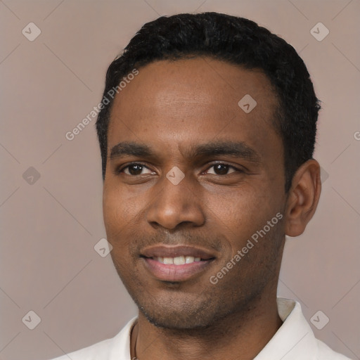 Joyful black young-adult male with short  black hair and brown eyes