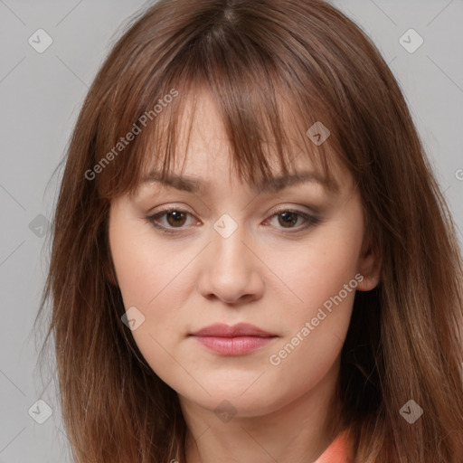 Neutral white young-adult female with long  brown hair and brown eyes