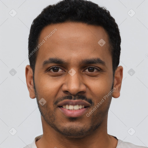 Joyful black young-adult male with short  black hair and brown eyes