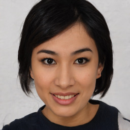 Joyful asian young-adult female with medium  black hair and brown eyes