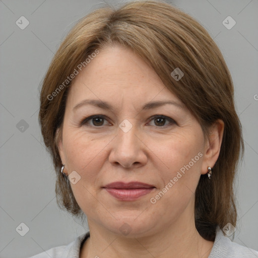 Joyful white adult female with medium  brown hair and grey eyes