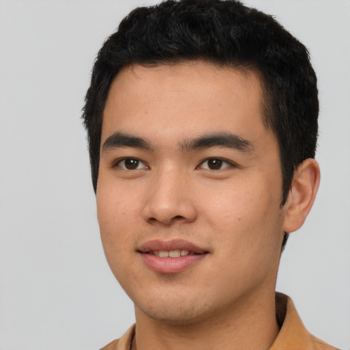 Joyful asian young-adult male with short  black hair and brown eyes