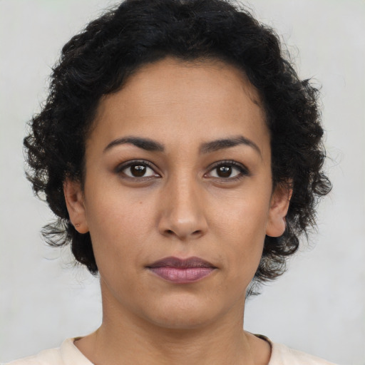 Neutral latino young-adult female with short  brown hair and brown eyes