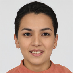 Joyful asian young-adult female with short  black hair and brown eyes