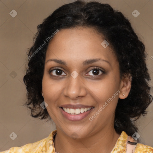 Joyful black young-adult female with medium  brown hair and brown eyes