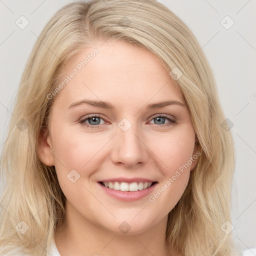 Joyful white young-adult female with long  brown hair and blue eyes