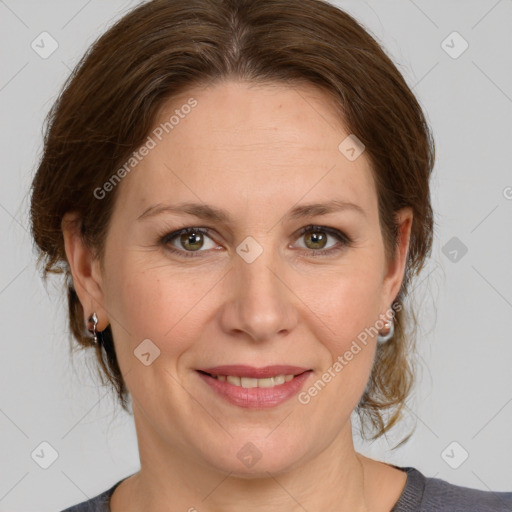 Joyful white adult female with medium  brown hair and grey eyes