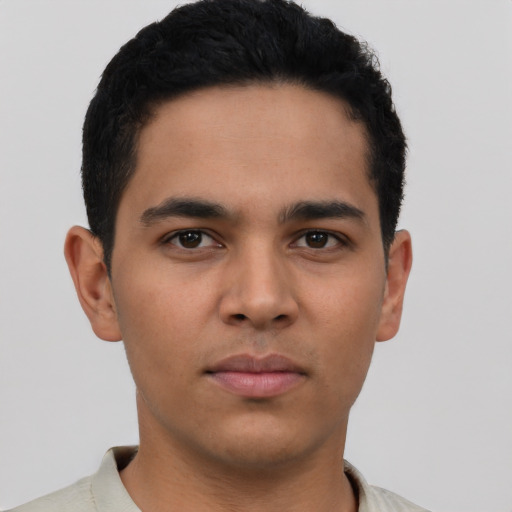 Neutral latino young-adult male with short  brown hair and brown eyes
