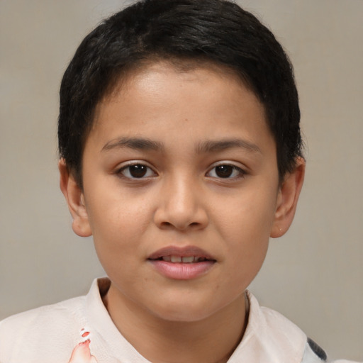 Joyful latino child female with short  brown hair and brown eyes