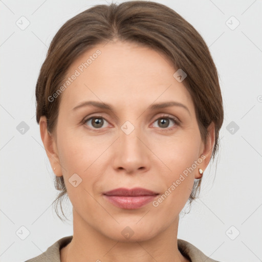 Joyful white adult female with short  brown hair and grey eyes