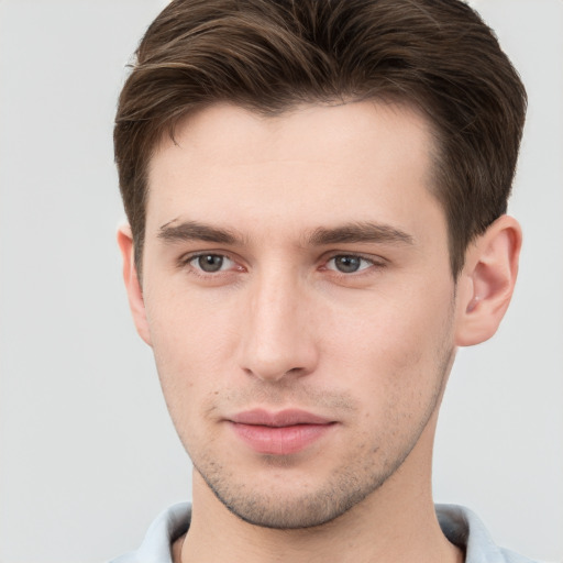 Neutral white young-adult male with short  brown hair and brown eyes