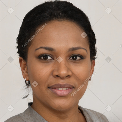 Joyful black young-adult female with short  black hair and brown eyes