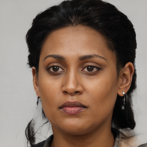 Neutral black young-adult female with long  black hair and brown eyes
