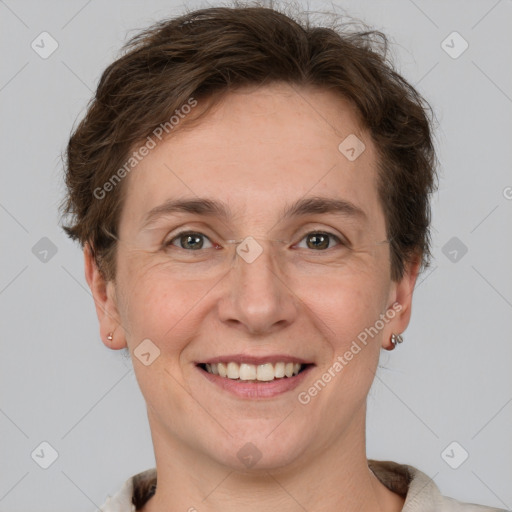 Joyful white adult female with short  brown hair and grey eyes