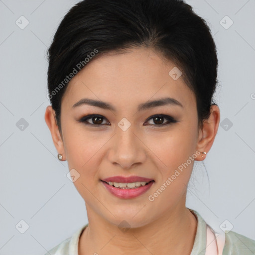 Joyful asian young-adult female with short  brown hair and brown eyes