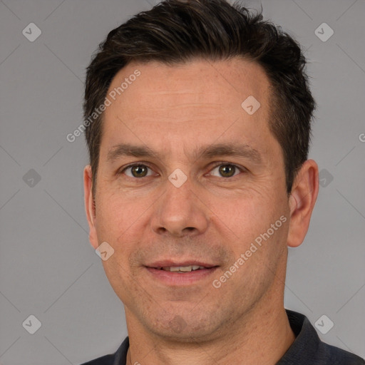 Joyful white adult male with short  brown hair and brown eyes