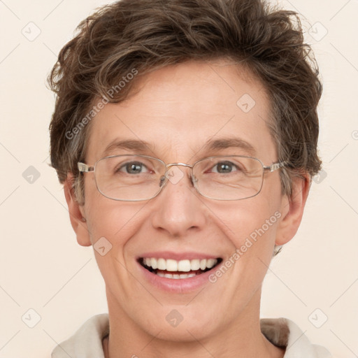 Joyful white adult female with short  brown hair and grey eyes