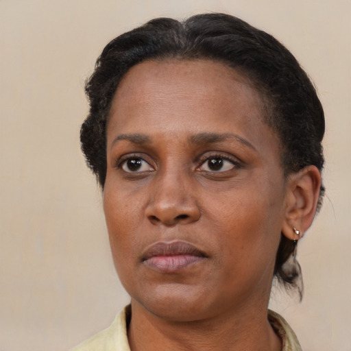 Neutral black adult female with short  brown hair and brown eyes