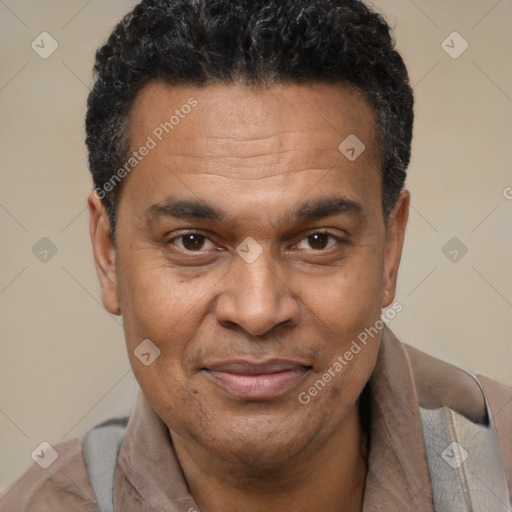 Joyful latino adult male with short  brown hair and brown eyes