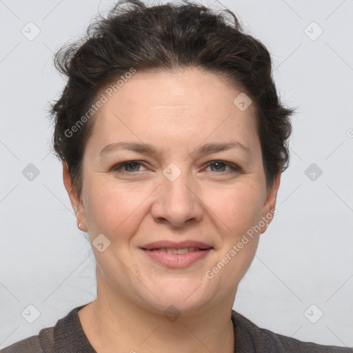 Joyful white adult female with short  brown hair and brown eyes