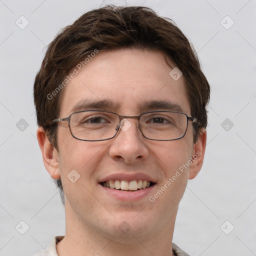 Joyful white adult male with short  brown hair and grey eyes