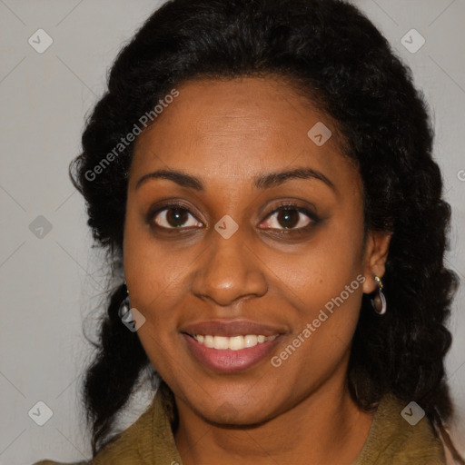 Joyful black adult female with long  brown hair and brown eyes